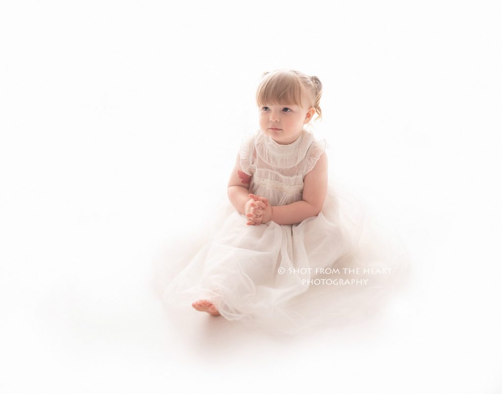 preschooler in white dress professional photograph image on white background angel simple pure