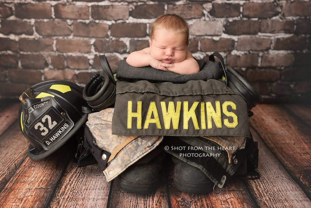 newborn baby photography with firefighter turnout bunker gear