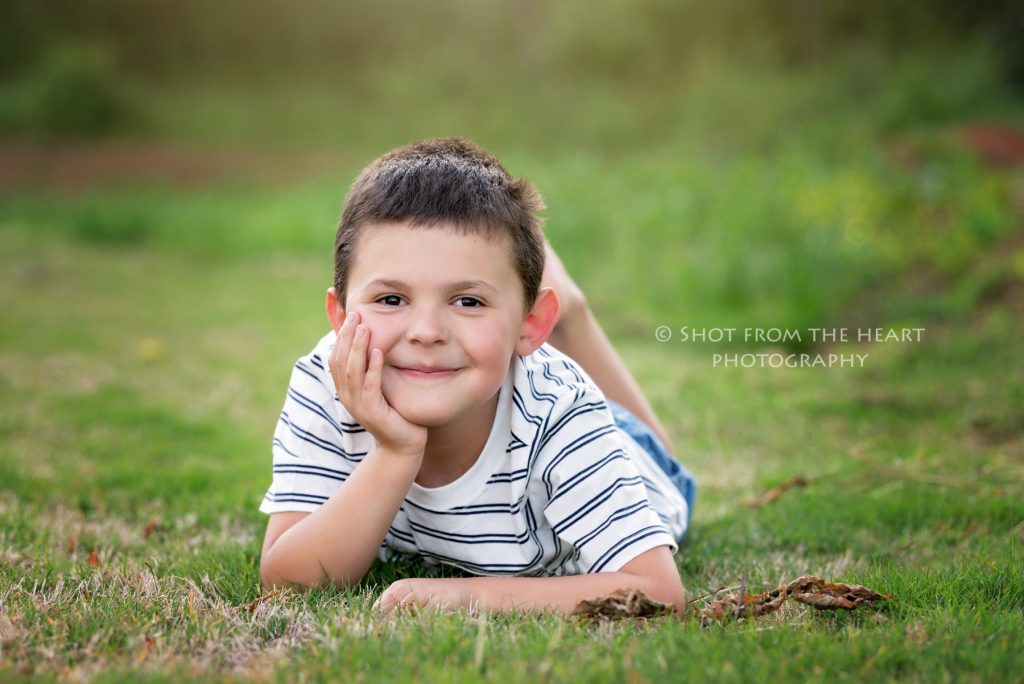 smiling boy in grass, child photographer, Cartersville Georgia