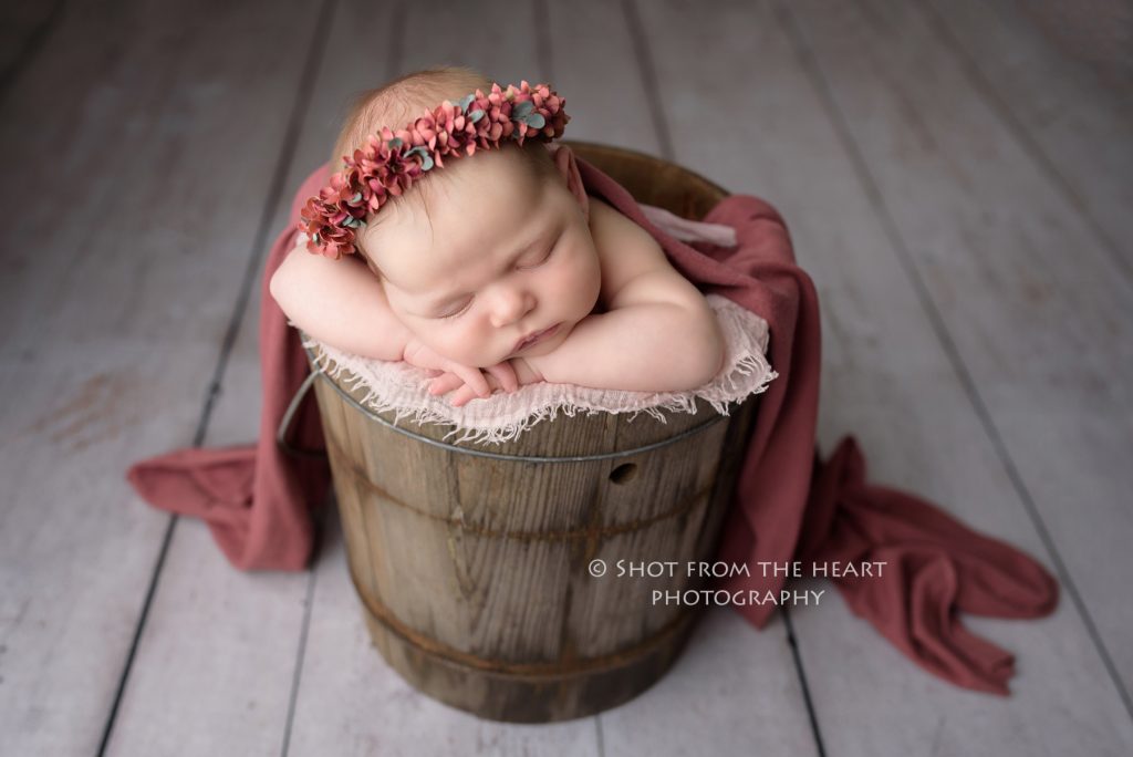rustic newborn photographer Alpharetta Georgia, newborn baby girl in old bucket prop