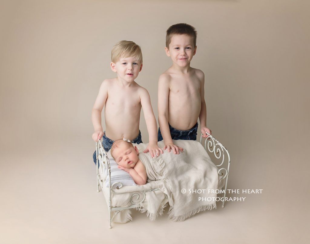 brothers with newborn baby sister photography. 