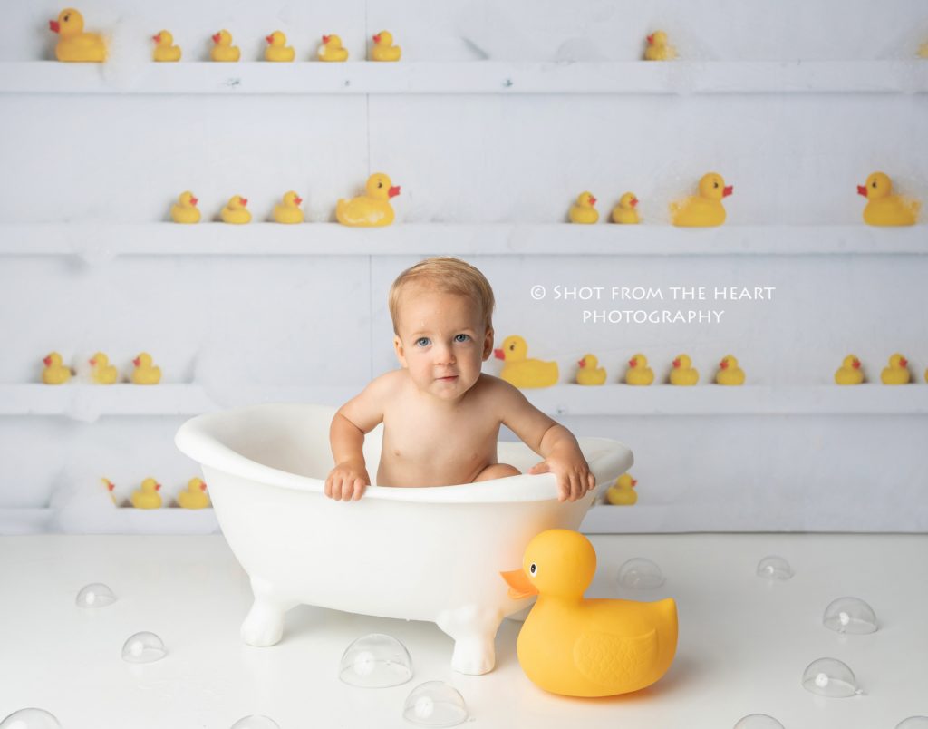 bubble bath after cake smash photography session, first birthday