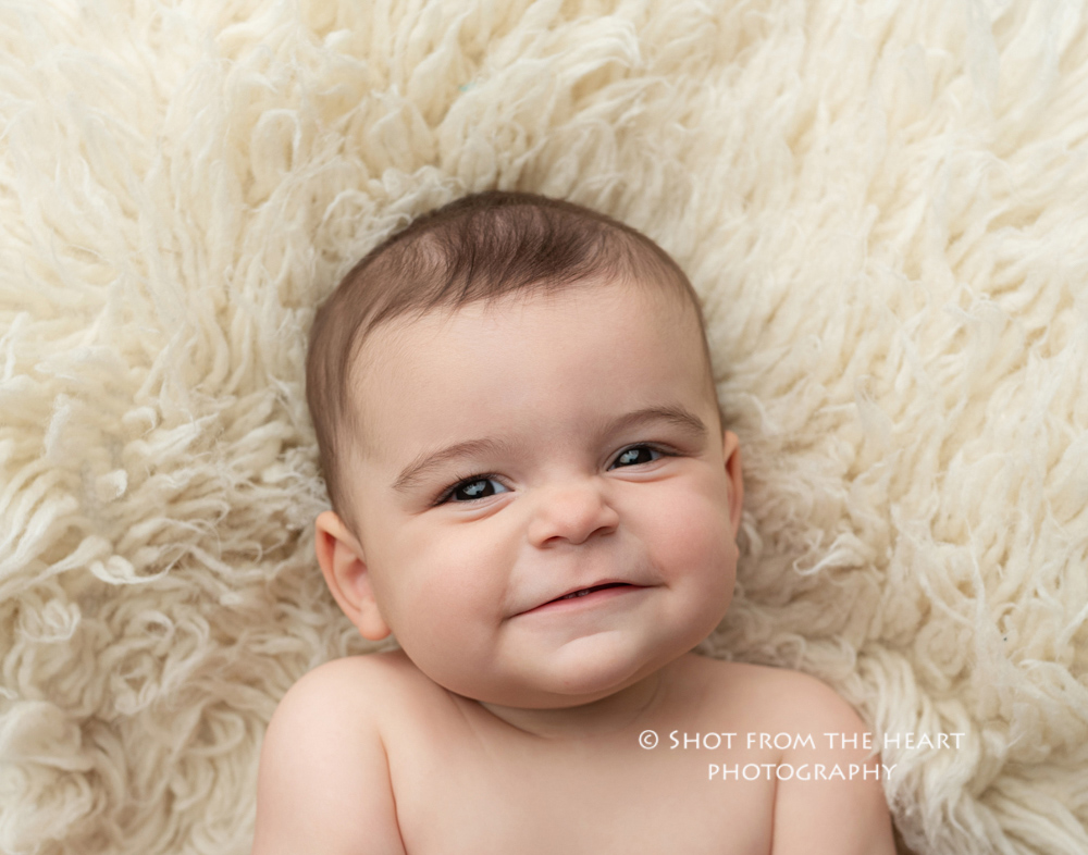 expressive baby photography on float cream rug