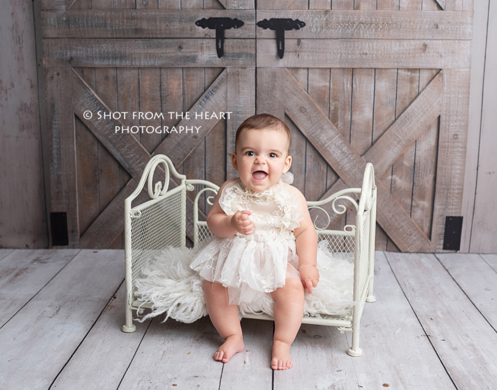 baby with rustic girl barn photography background