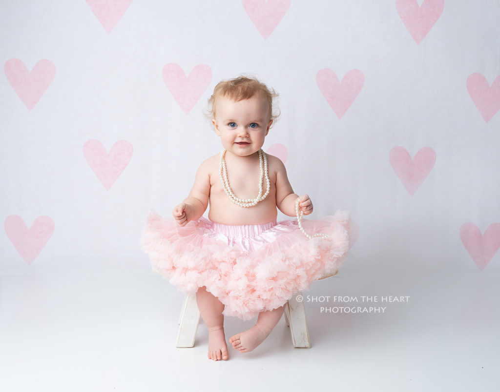 First birthday photography session girl heart backdrop