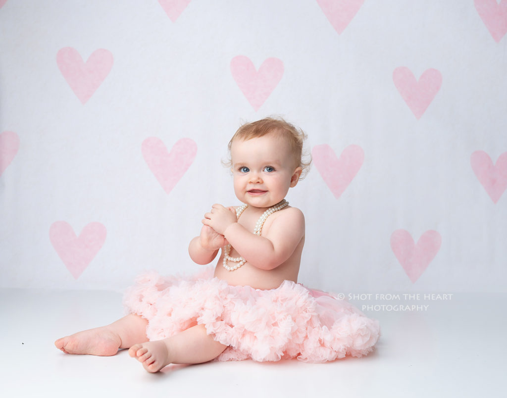 First birthday photography session girl heart backdrop