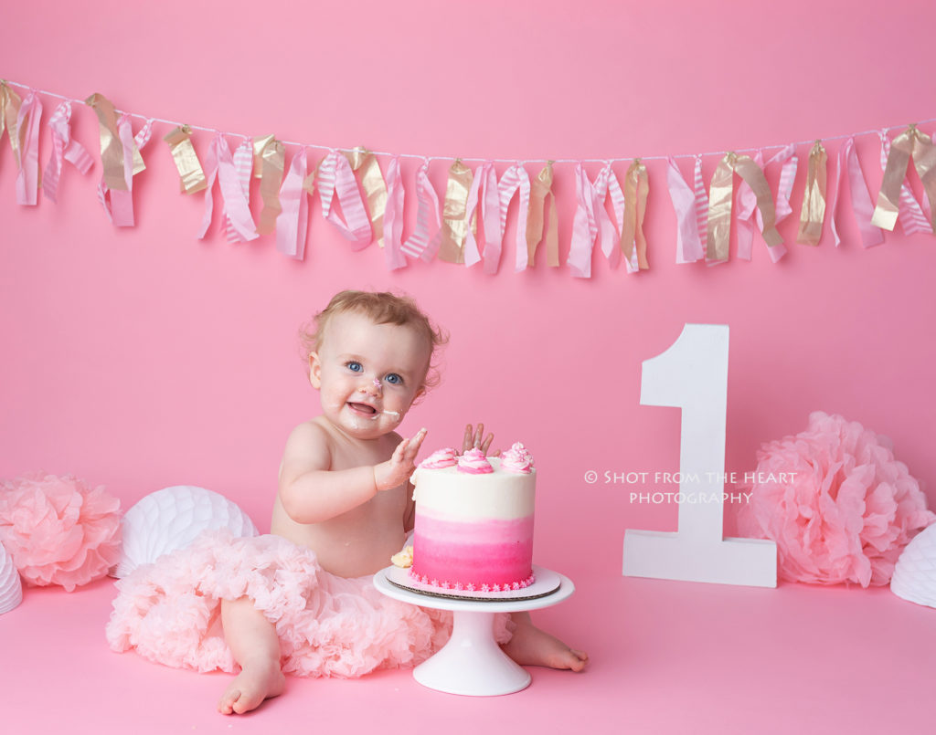 First birthday girl pink backdrop cake smash