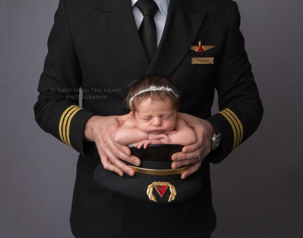 newborn baby photographer pilot hat dad