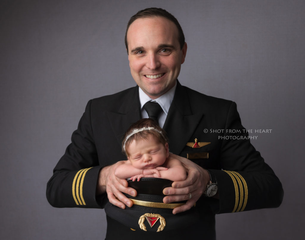 dad pilot uniform newborn baby photography