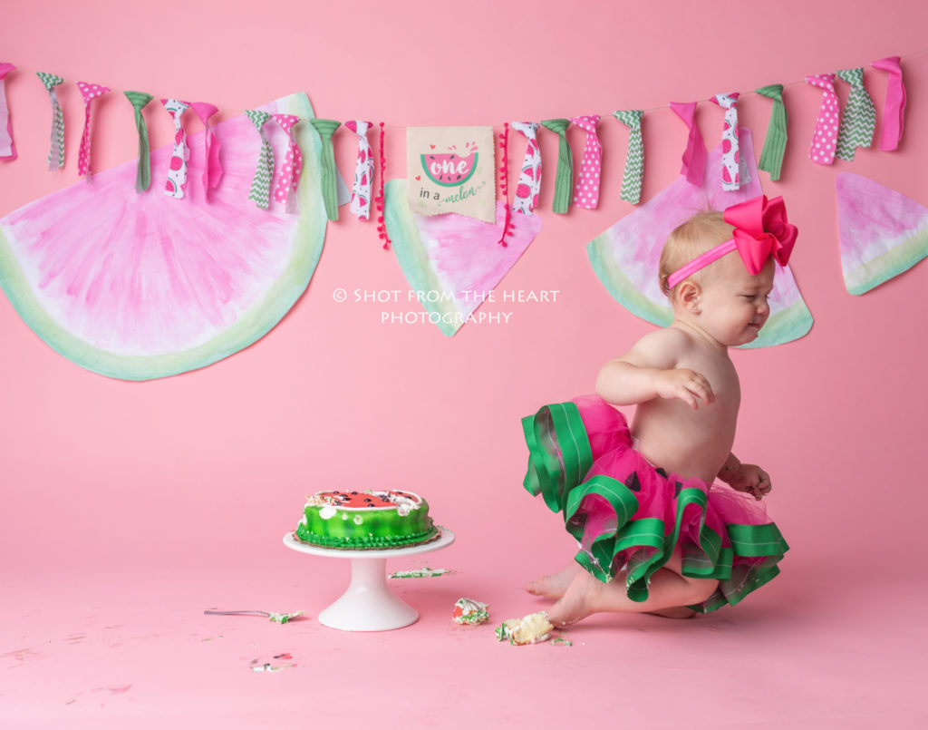 baby crawling away from cake melon theme