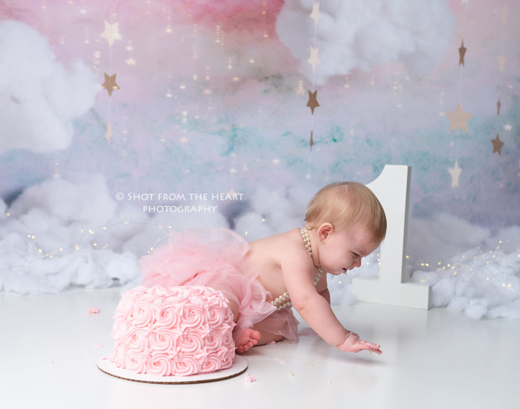 baby crawling away from cake